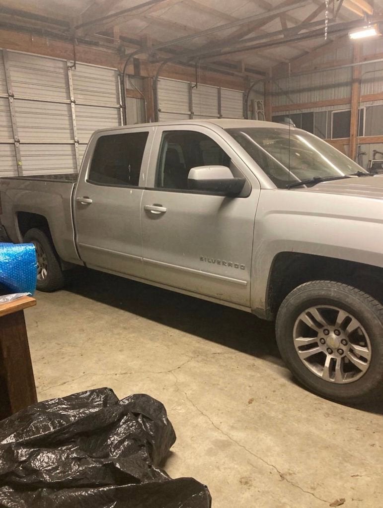 2015 Chevrolet Silverado 1500 LT in Silver Ice Metallic — front three-quarter view