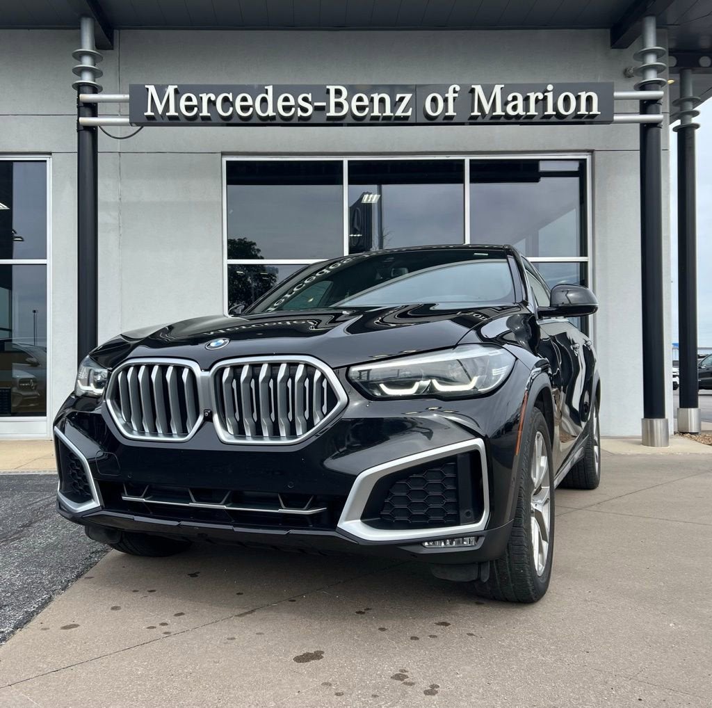 2021 BMW X6 xDrive40i in Black — front three-quarter view