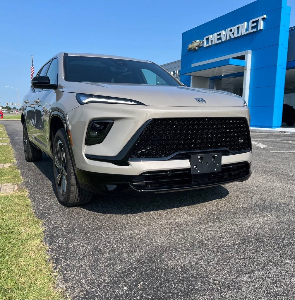 2026 Buick Enclave Sport Touring in Stone Metallic — front three-quarter view