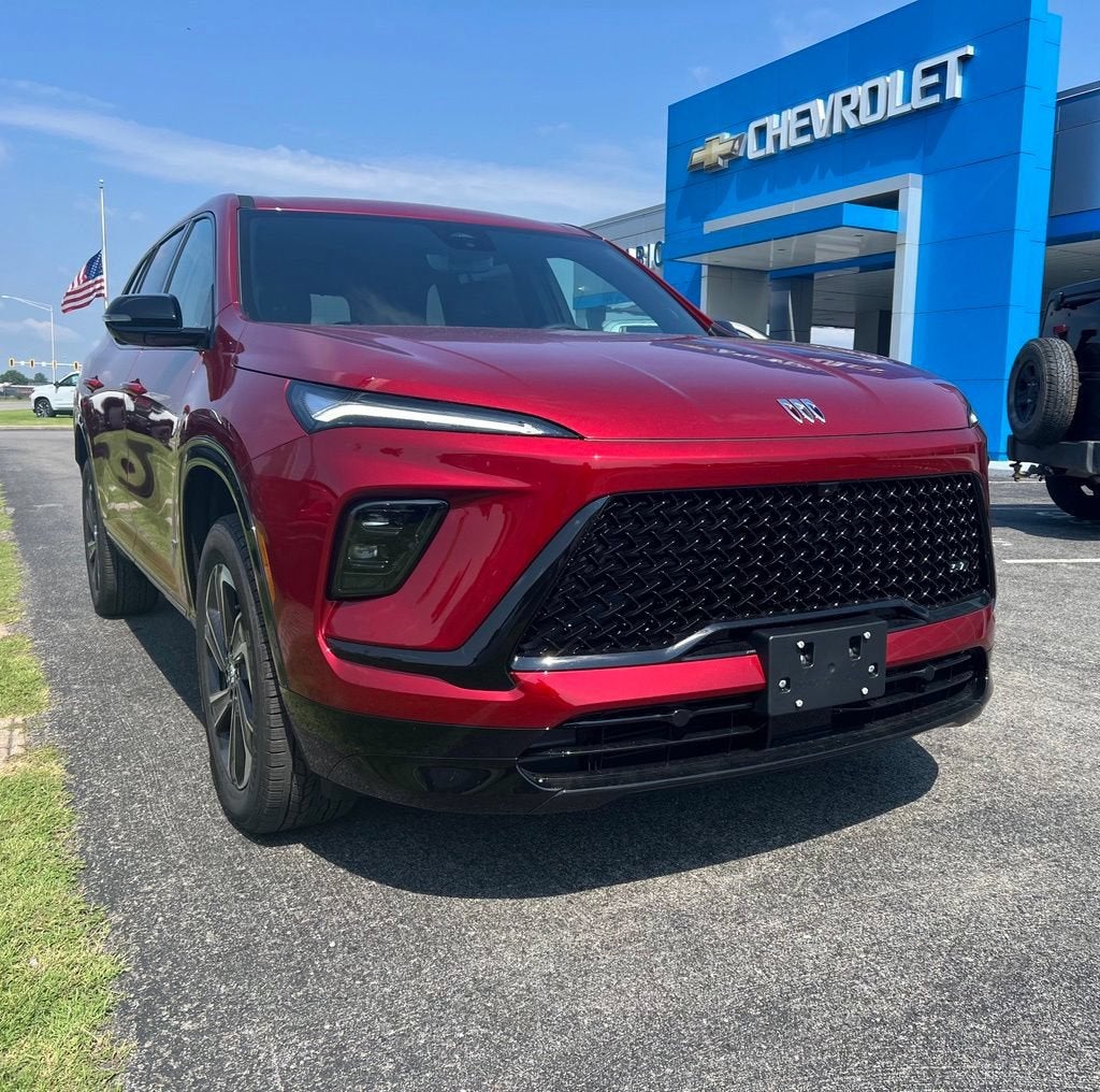 2026 Buick Enclave Sport Touring in Cherry Red Tintcoat — front three-quarter view